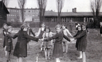 Ingeborg Larišová (in a dress skirt) with children from the Šalamoun mine colony, Ostrava, circa 1950