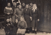 Banat Czechs photographed in Comanesti. Top left: Kristýna Fiklová with sister Aloisie Jágrová. Next to them is František Fikl, his sister in front of him, and Aloisie Jágrová’s husband is on his left. The two women on the right are Aloisie Jágrová’s sisters-in-law, visiting Comanesti. Bottom row: sister Anna Urban, cradling her brother Josef, next is Margareta, and cousin who came for a visit. Comanesti, Romania, circa 1954
