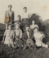 Relatives on a visit to Comanesti. Sisters Anna and Margareta Fikls are absent. Viktor Fikl holds an accordion; father František is top right, with wife Kristýna at his left. Comanesti, Romania, early 1950s
