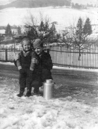 Stanislav Navrátil with a child from his neighbors / Vír / around 1949
