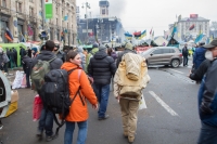 2014, 19 February - Kyiv, Maidan - Hanna Dovbakh (wearing an orange jacket with a black shoulder bag)