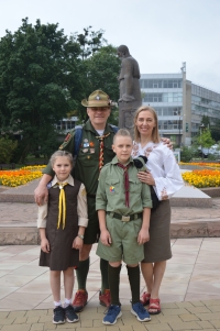 The Yasnyskyi family at the monument to Hrushevsky, 2022