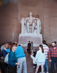 Iveta Clarke in front of the an Abraham Lincoln statue in the United States