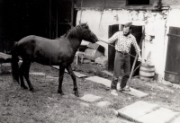 On the farm of his wife Jitka's parents with his first horse named Nuget, 1988