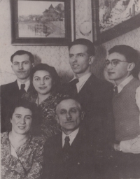 The Nágls with their friends. Sitting: František Mořic and Vlasta, standing: their children Věra and Miloš (wearing glasses). The family was murdered in a concentration camp 

