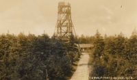 The lookout tower on the Smrk mountain (Tafelfichte) from 1892 on a historical postcard. The borders of Bohemia, Lusatia and Silesia used to meet at Smrk. Since June 1938, the border was guarded by a State Defense Guard unit, which left the hut near the lookout tower on the night of October 1, 1938 without paying (the hut, which was run by a German administrator before the war, burned down in 1946, the unmaintained wooden tower collapsed in the 1960s).