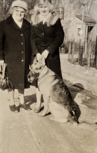 With her mother and her beloved dog