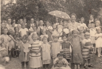 Renata Hillmannová (standing second from the right in the front, wearing a dress) in the kindergarten in Schnellau, circa 1935
