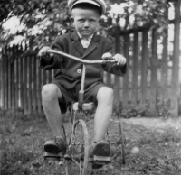 Ladislav Kubín as a child on his tricycle, 1939