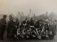 A group photo of footballers from Ondřejov on the occasion of a friendly match between Ondřejov and an unnamed Austrian team, Václav Vycpálek in the top row wearing a white shirt and tie, 1970
