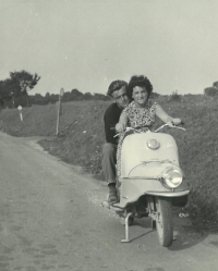 Marta Mezerová with a friend on a motorbike in Halič