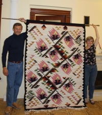 The revival of carpet weaving in Hlyniany. Przemek Cklak (Warsaw, Poland) and Maria Fleychuk (Lviv, Ukraine) with a newly woven carpet by Sofia Stryenska, made by Zenoviia Shulha and Tekla Rybak, 2021