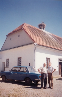 In front of his native farm with Stanislav Chlapil, who bands storks, 2005