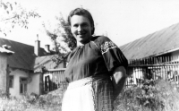 Anna Krpešová's mother, Anna Duží, in front of her house in Staré Hamry, during the WWII

