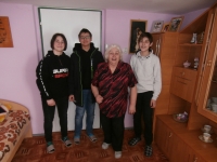 Milada Pavelková with Lukáš Kubica, Denis Mišněv, and Marek Černohous, the students who worked on the Stories of Our Neighbours, 9 November 2021