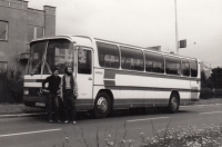 Dušan Perička (right) in front of a bus, 1972