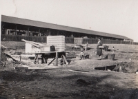 Construction of the Lidový dům community centre, circa 1930, modelling shops in the background
