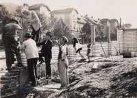 Construction of the Lidový dům in Karlov, residential development in the background, circa 1930
