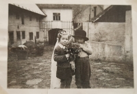 Marie with a neighbor, 1953. At the time when grandfather Hornický was being evicted, she found a veil in the house, which she put on, and the adults took a picture of them together