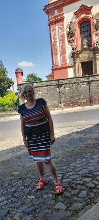 Marie Vladyková near her house on the square in Zlonice, 2023