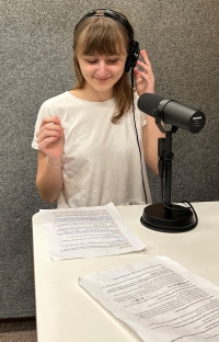 A member of the student team recording a radio report