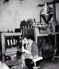 Ludmila Jahnová's mother at work in the new materials pressing shop / Leskovec nad Moravicí / about 1987