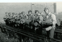In the military before the jump (fifth from the right)