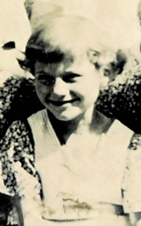 Cutout from a poor quality photograph from the childhood of Marie Kadeřábková, Volyně, second half of the 1930s.