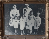 With his stepmother and siblings