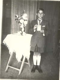 Ihor Kalynets with a certificate of his First Holy Communion, Khodoriv