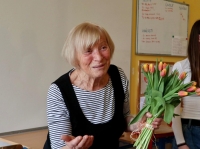 Anna Hurychová with a flower, 2023