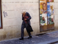 Adriena Šimotová on Betlémské Square on her way to the antiquary bookshop Ztichlá klika, 1990s