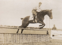 Witness's father Stanislav Zedníček show jumping a horse, his favourite sport; early 1930s