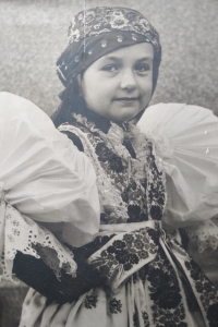 Květoslava Šmídová in her childhood in folk costume from Kyjov