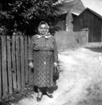 Witness´s mother Leokádie Stočková on the road in front of her house in Svoboda