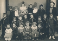 Zdeněk Bartl (seated second from right in the bottom row) with other children performing in a children's school theatre, 1956