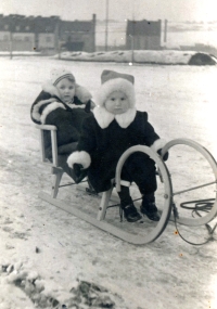 February 1944 in Prague, on the way to the air-raid shelter. Eva Kopejsková is the first child on the sledge