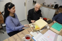Jindřich Fencl with documentary filmmaker Jarmila Vandová Flaková browsing documents regarding her grandfather Colonel Jiří Flak and their mutual family friend Colonel Luboš Hruška, 2 April 2025
