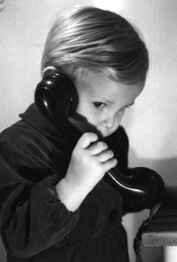 Jiří Růžička in his childhood pretending to make a phone call