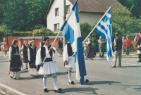 Alexander Papageorgiou with his son and the former and the current Greek flags