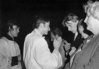 Alois Křišťan receiving the blessing of a new priest