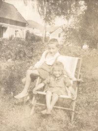 Joyful childhood in the garden in Křenov. Marie with her brother Jindřich