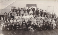 The witness (fourth left, bottom row) in a group photo of orphanage children, late 1940s