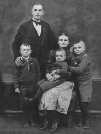 Vilém Lasák (in his mother Vilemína's lap) with his father Vilém and brothers, 1937