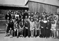 Adéla Lasáková left of and above the teacher (wearing glasses), school photo, latter 1940s