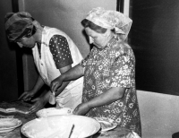 Adéla Lasáková (right) preparing cookie dough at a wedding, probably 1980s