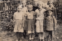 Six-year-old Anna Plobner (left) with other children in the neighbours' garden, Pavlův Studenec in 1938
