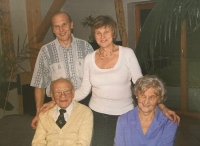 With her husband and children