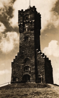 The former Praděd lookout tower on a postcard from the 1930s or 1940s. The original tower collapsed in 1969 and a new TV transmitter was built in its place in the 1960s.