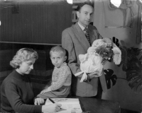 Witness (centre) with his parents and younger brother at the welcome ceremony, 1961